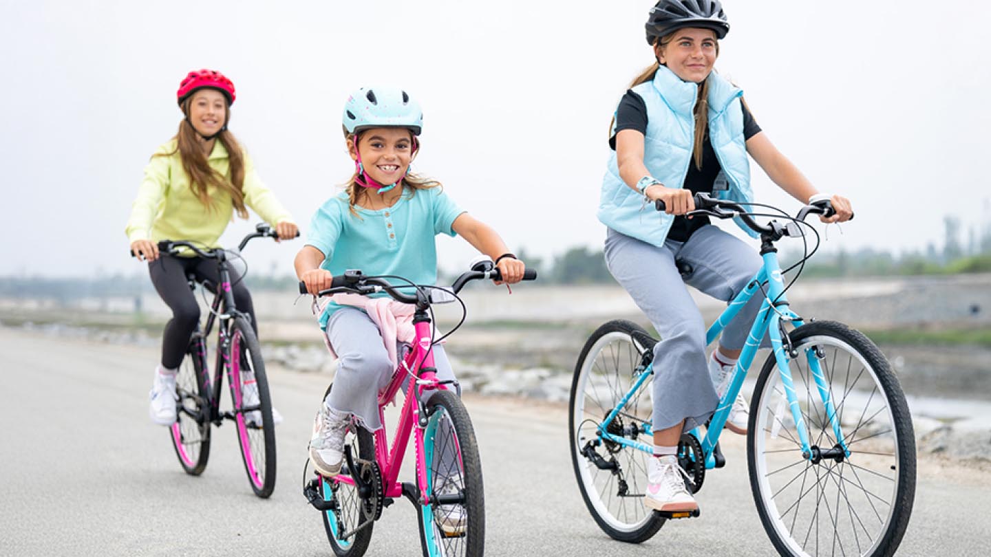 People using bikes from Gaudrian Bikes banner