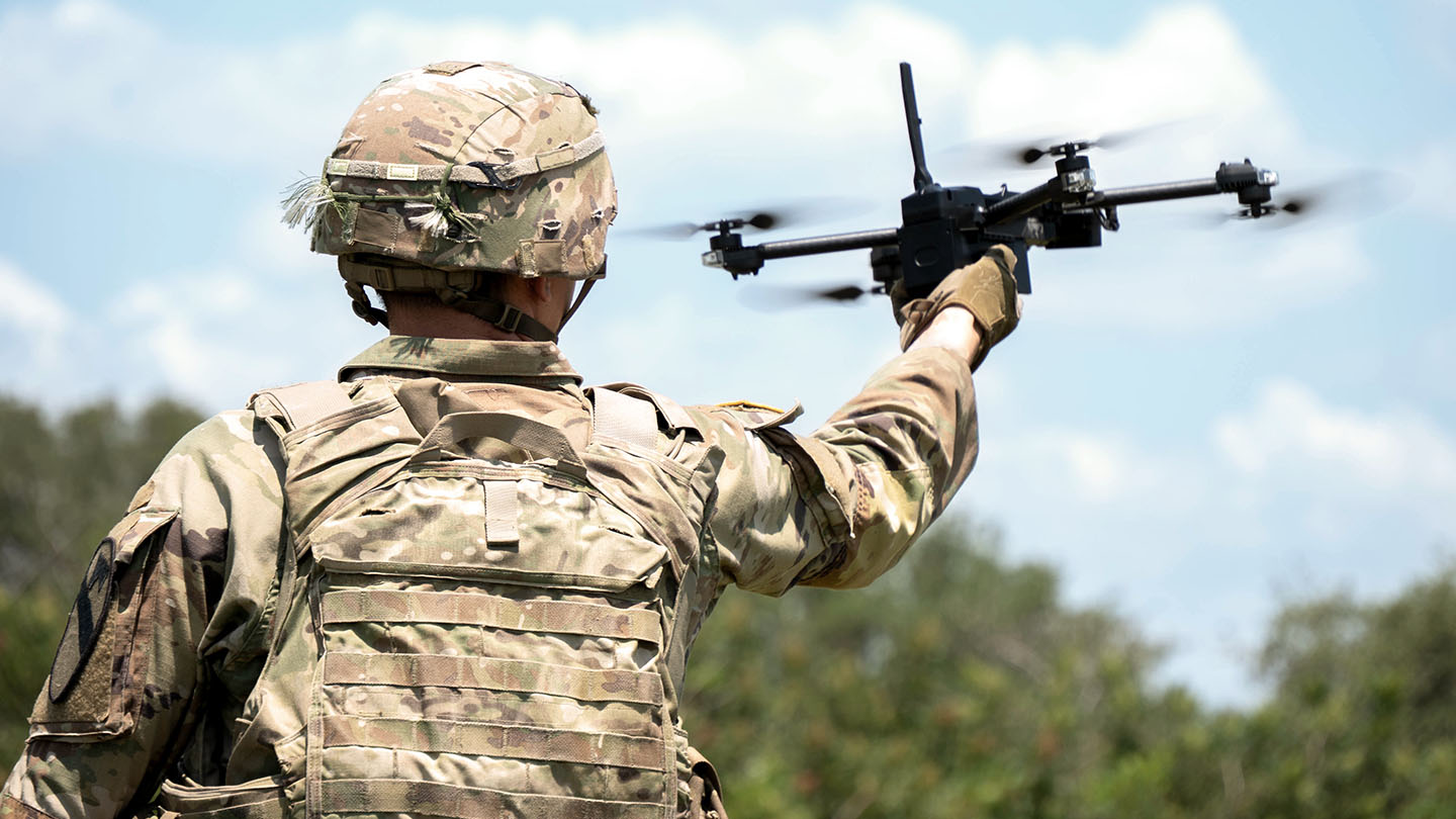 Military member with drone
