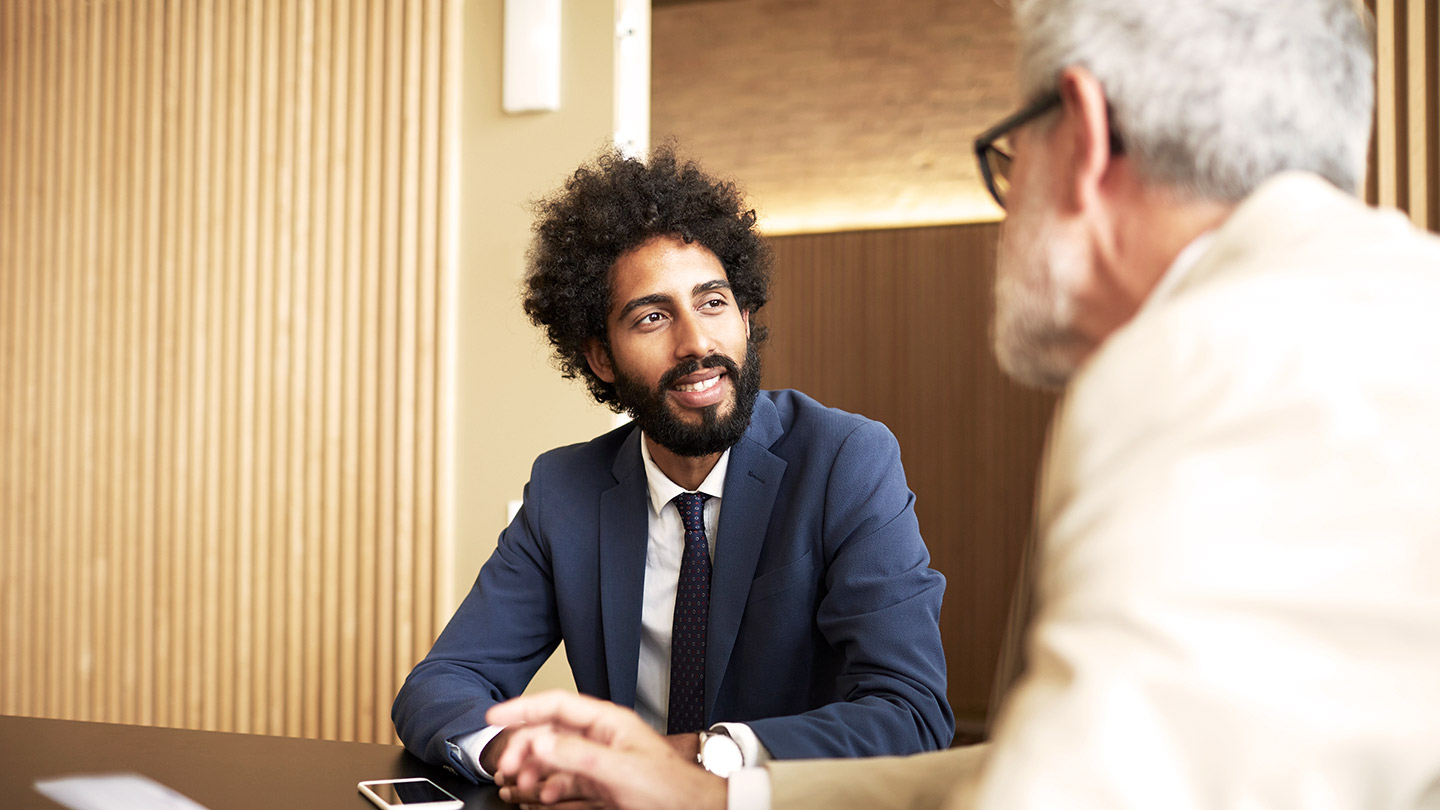 2 people in a meeting banner
